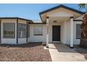 Front entrance of a single story home with a covered porch at 1527 W Rosemonte Dr, Phoenix, AZ 85027