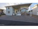 Single-story home with covered porch and landscaped yard at 17200 W Bell Rd # 1165, Surprise, AZ 85374