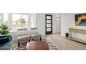 Entryway with contemporary console table and wood-look floors at 1913 E Sandra Ter, Phoenix, AZ 85022