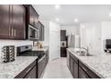 Modern kitchen with stainless steel appliances and granite countertops at 25412 N 144Th Dr, Surprise, AZ 85387