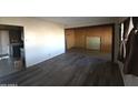 Living room with laminate flooring and built-in shelving at 303 W 13Th St, Eloy, AZ 85131