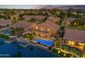 Stunning aerial view of a waterfront property with a pool and patio at 3180 S Greythorne Way, Chandler, AZ 85248