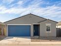 Single-story home featuring a well-maintained yard, blue garage door, and desert landscaping at 3403 E Audrey Dr, San Tan Valley, AZ 85143