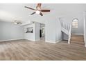 Light and spacious living room with laminate floors and a staircase at 3745 W Carol Ann Way, Phoenix, AZ 85053