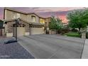 Two-story house with stone accents, a three-car garage and basketball court at 4142 E Ravenswood Dr, Gilbert, AZ 85298