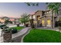 Two-story house with stone accents and a landscaped front yard with a walkway at 4142 E Ravenswood Dr, Gilbert, AZ 85298