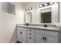 Updated bathroom with double vanity and gray countertops at 4316 E La Puente Ave, Phoenix, AZ 85044