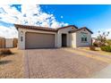 New construction home with a two-car garage and front walkway at 4806 S 110Th Ave, Tolleson, AZ 85353