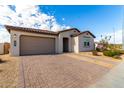 New construction home with a two-car garage and front walkway at 4806 S 110Th Ave, Tolleson, AZ 85353