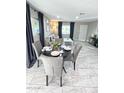 Charming dining area with a round table and four gray chairs at 6025 S 13Th St, Phoenix, AZ 85042