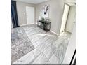 Modern entryway with tile flooring and a sleek console table at 6025 S 13Th St, Phoenix, AZ 85042