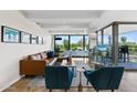 Modern living room with leather sofas and large windows at 7117 E Rancho Vista Dr # 4005, Scottsdale, AZ 85251