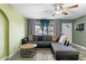 L-shaped sectional sofa and a coffee table in the living room at 7214 N 35Th Ave, Phoenix, AZ 85051