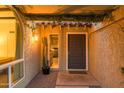 Inviting entryway with a dark wood door and a glimpse into the interior at 7301 E Claremont St, Scottsdale, AZ 85250