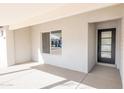 Modern entryway with black door and large window, showcasing natural light at 11252 N 37Th St, Phoenix, AZ 85028