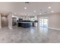 Spacious kitchen with island, stainless steel appliances, and stylish cabinetry at 11252 N 37Th St, Phoenix, AZ 85028