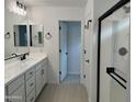 Main bathroom with double vanity and walk-in shower at 1223 W Sparrow Dr, Queen Creek, AZ 85140