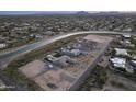 Aerial view showcasing a luxury home with a pool and desert landscape at 12331 E Gold Dust Ave, Scottsdale, AZ 85259