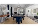 Elegant dining room with a dark wood table and navy blue velvet chairs at 1638 E Hackamore St, Mesa, AZ 85203