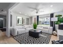 Modern living room featuring light colored sectional sofa and geometric rug at 1638 E Hackamore St, Mesa, AZ 85203