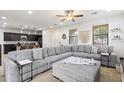 Spacious living room featuring a sectional sofa and kitchen views at 1705 S 82Nd Pl, Mesa, AZ 85209