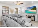 Relaxing living room with sectional sofa and large TV at 1705 S 82Nd Pl, Mesa, AZ 85209