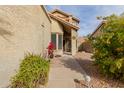 Landscaped front yard with walkway leading to the entrance of a tan house at 1740 W Del Rio St, Chandler, AZ 85224