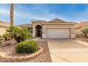 House exterior showcasing a two-car garage and neatly landscaped yard at 18109 W Skyline Dr, Surprise, AZ 85374