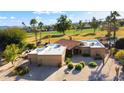 Stunning aerial view of a single-story home with a golf course view at 19035 E Tonto Trl, Rio Verde, AZ 85263