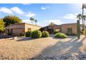 Single story home with attractive desert landscaping and a two car garage at 19035 E Tonto Trl, Rio Verde, AZ 85263