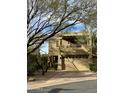 Beautiful two-story home with a two-car garage and desert landscaping at 28414 N 101St Pl, Scottsdale, AZ 85262