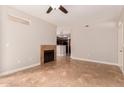 Living room with tile floors, fireplace, and view of kitchen at 3830 E Lakewood Pkwy # 1114, Phoenix, AZ 85048