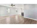 Bright and spacious living room with wood-look floors and ceiling fans at 3850 N 12Th Ave, Phoenix, AZ 85013