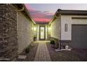 Charming entryway with a decorative door and brick pathway at 39725 N Hailey Ln, San Tan Valley, AZ 85140