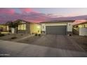 Well-maintained house with a gray garage door and brick pavers at 39725 N Hailey Ln, San Tan Valley, AZ 85140