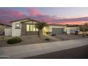 Stunning curb appeal featuring a two-car garage and inviting walkway at 39725 N Hailey Ln, San Tan Valley, AZ 85140