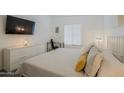 Main bedroom with a king-size bed, dresser, and a workspace at 4754 N 14Th St, Phoenix, AZ 85014