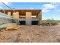 Unfinished garage with concrete foundation and wood framing at 4975 E Mcdonald Dr, Paradise Valley, AZ 85253