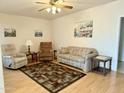 Living room features hardwood floors, comfy seating, and southwestern decor at 7750 E Broadway Rd # 232, Mesa, AZ 85208