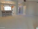 Open living area with a breakfast bar and view into the kitchen at 14838 S 47Th Way, Phoenix, AZ 85044