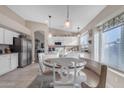 Bright kitchen boasts white cabinets and an island at 1658 S Oak St, Gilbert, AZ 85233