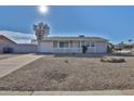 Charming single story home with a gravel front yard at 1801 E Paradise Ln, Phoenix, AZ 85022