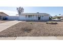 Newly remodeled home with a rock front yard at 1801 E Paradise Ln, Phoenix, AZ 85022