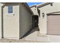 Front entry with walkway leading to the garage and front door at 19028 W Rose Ln, Waddell, AZ 85355