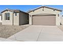 Modern two-car garage and front yard with gravel at 19028 W Rose Ln, Waddell, AZ 85355