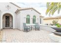 Brick patio with rocking chairs, offering a relaxing space at 19612 N Wasson Peak Dr, Surprise, AZ 85387