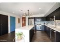 Modern kitchen with island and stainless steel appliances at 200 W Portland St # 715, Phoenix, AZ 85003