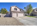 Two-story house with three-car garage and gravel landscaping at 20997 N 79Th Ave, Peoria, AZ 85382