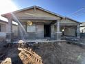 New construction home exterior featuring a front porch and two-car garage at 22851 E Lords Way, Queen Creek, AZ 85142