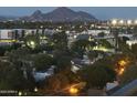 Night aerial view showcasing city lights and mountain backdrop at 2323 N Central Ave # 906, Phoenix, AZ 85004